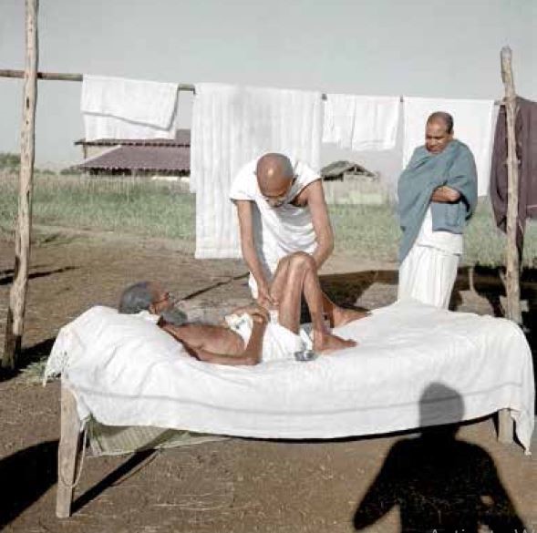 Mahatma Gandhi attending to a leprosy patient, Parchure Shastri at Sevagram Ashram, Wardha, 1940 (Photo - IJMR)